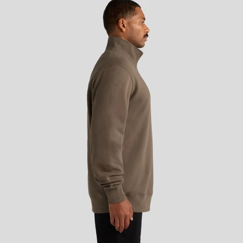 A brown half-zip crew jumper, featuring a stand-up collar and a side view of a model. The garment has a logo.