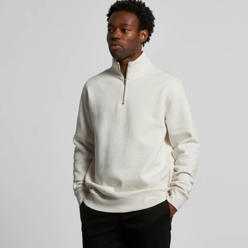 A cream Stencil Half Zip Crew jumper featuring a high collar and a zip closure, worn by a model.