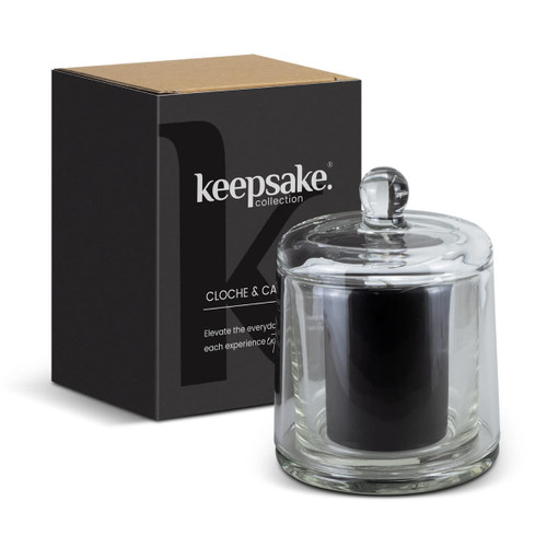 A glass candle in a cloche with a black candle inside, paired with a stylish box, featuring a logo. A glass candle in a cloche with a black candle inside, paired with a stylish box, featuring a logo.