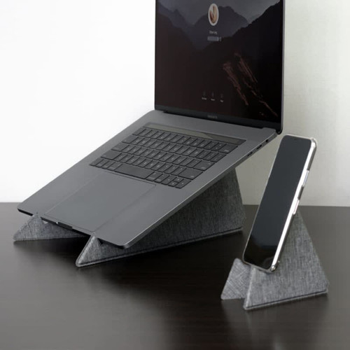 A grey eco-friendly laptop stand with a laptop and a phone stand, both featuring a triangular design. A grey eco-friendly laptop stand with a laptop and a phone stand, both featuring a triangular design.