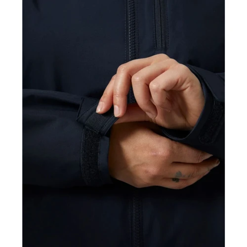 Close-up detail of the Crew Women's Midlayer Jacket 2.0 in navy featuring an adjustable hook-and-loop cuff tab for a secure and customizable fit.