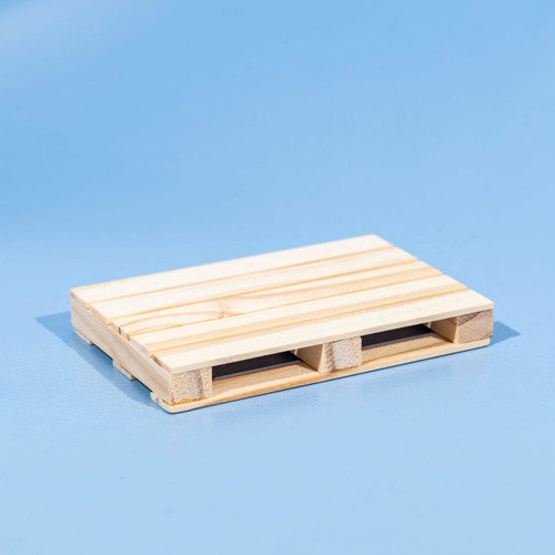 A wooden coaster designed to resemble a miniature pallet, featuring a natural light wood finish.