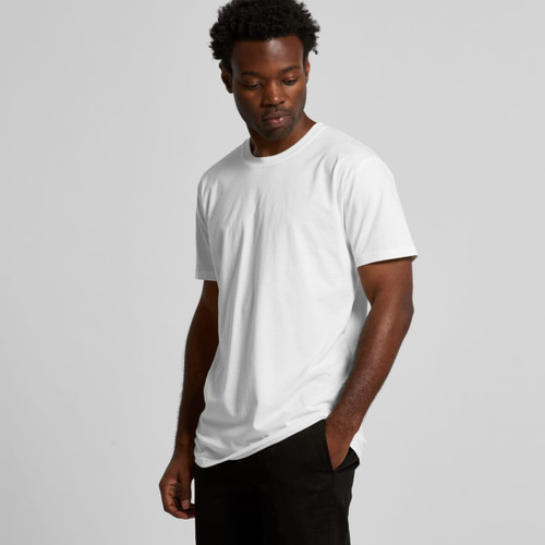 A plain white organic T-shirt displayed on a model, featuring a logo on the sleeve.