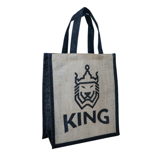 A jute tote bag in natural and navy blue featuring a lion logo and the word "KING." A jute tote bag in natural and navy blue featuring a lion logo and the word "KING."