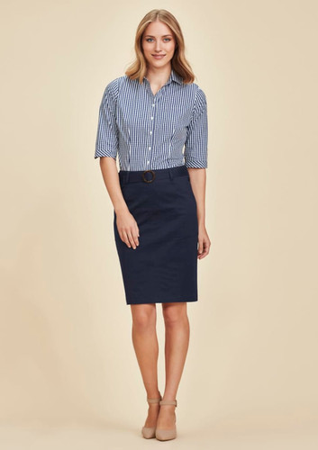 A woman wearing a navy mid waist stretch chino skirt paired with a striped shirt. The skirt features a belt and has a casual look. A woman wearing a navy mid waist stretch chino skirt paired with a striped shirt. The skirt features a belt and has a casual look.
