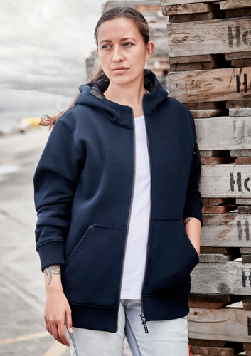 A navy unisex zip front hoodie with multiple pockets, worn by a woman against a backdrop of wooden pallets. A navy unisex zip front hoodie with multiple pockets, worn by a woman against a backdrop of wooden pallets.