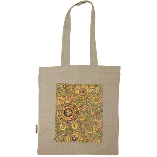 A recycled cotton twill tote in beige featuring an intricate pattern with circular designs. It has two long handles. A recycled cotton twill tote in beige featuring an intricate pattern with circular designs. It has two long handles.