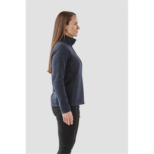 A navy blue women's pullover with a 1/4 zip design, featuring a high collar and a side profile view. A navy blue women's pullover with a 1/4 zip design, featuring a high collar and a side profile view.