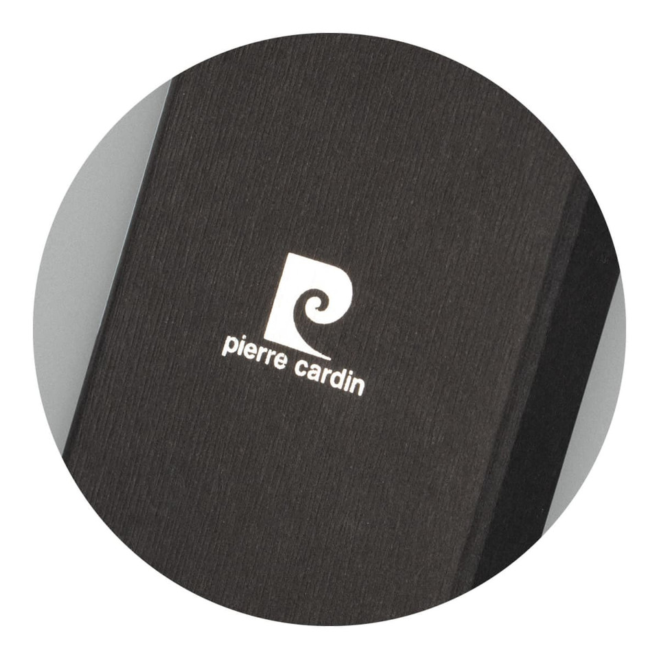 A black key ring with a textured finish and a white logo on its surface.