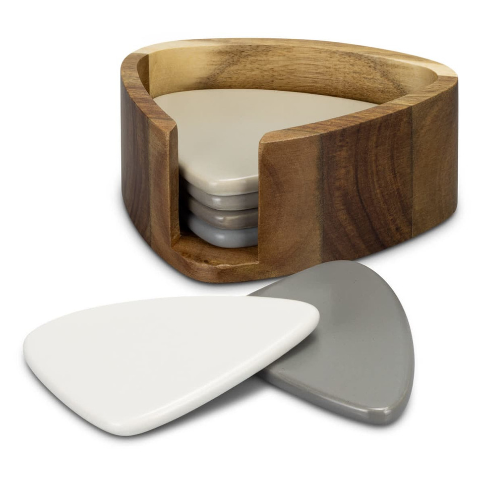 A wooden holder contains a set of four triangular coasters in grey and white tones.
