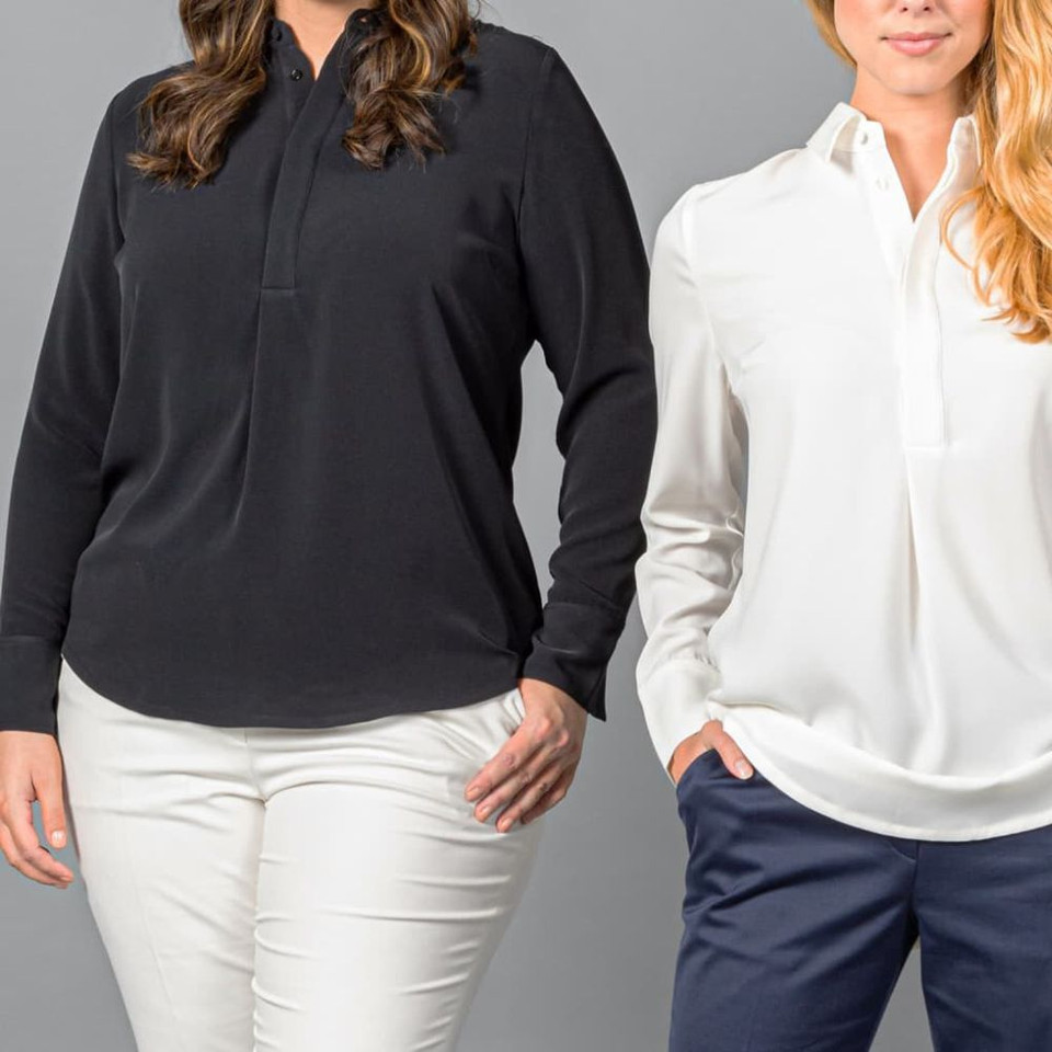Women's black and white long-sleeve blouses with professional pants.