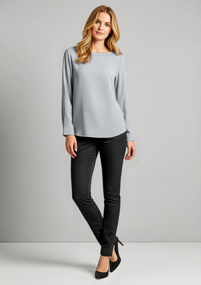 A model wearing grey top and black leggings stands against a plain background. The leggings have a sleek design and a logo.