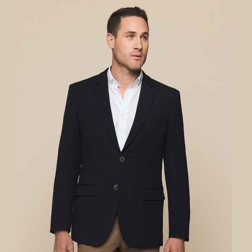 A man wearing a black man's blazer featuring a single-breasted design, two front pockets, and a tailored fit.