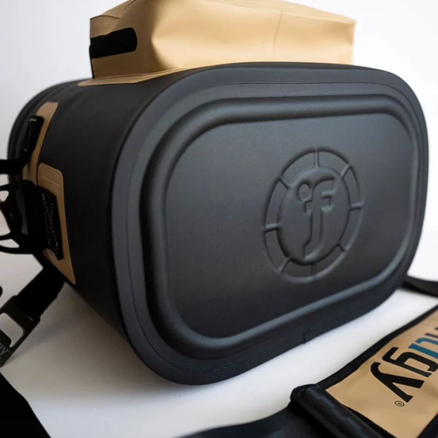 Stylish black and tan camera bag with embossed logo, versatile photography gear storage.