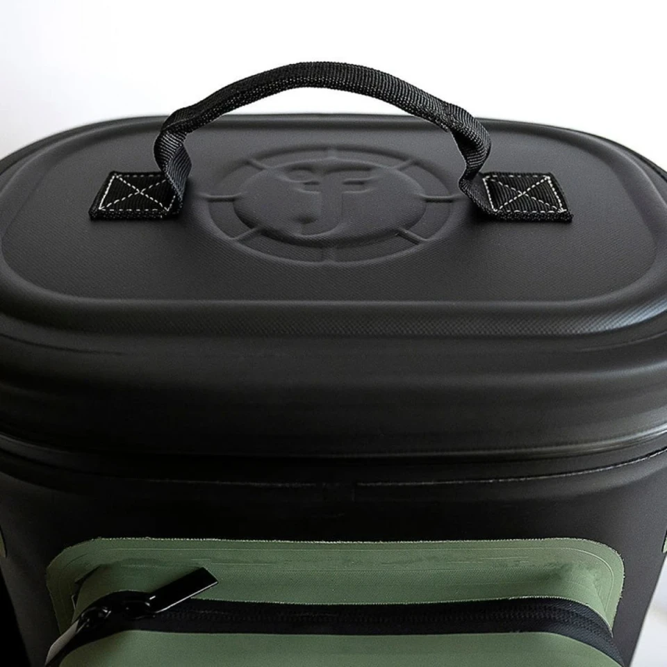 Close-up of the cooler bag's reinforced top carry handle and waterproof zippered lid designed for secure and durable transport.