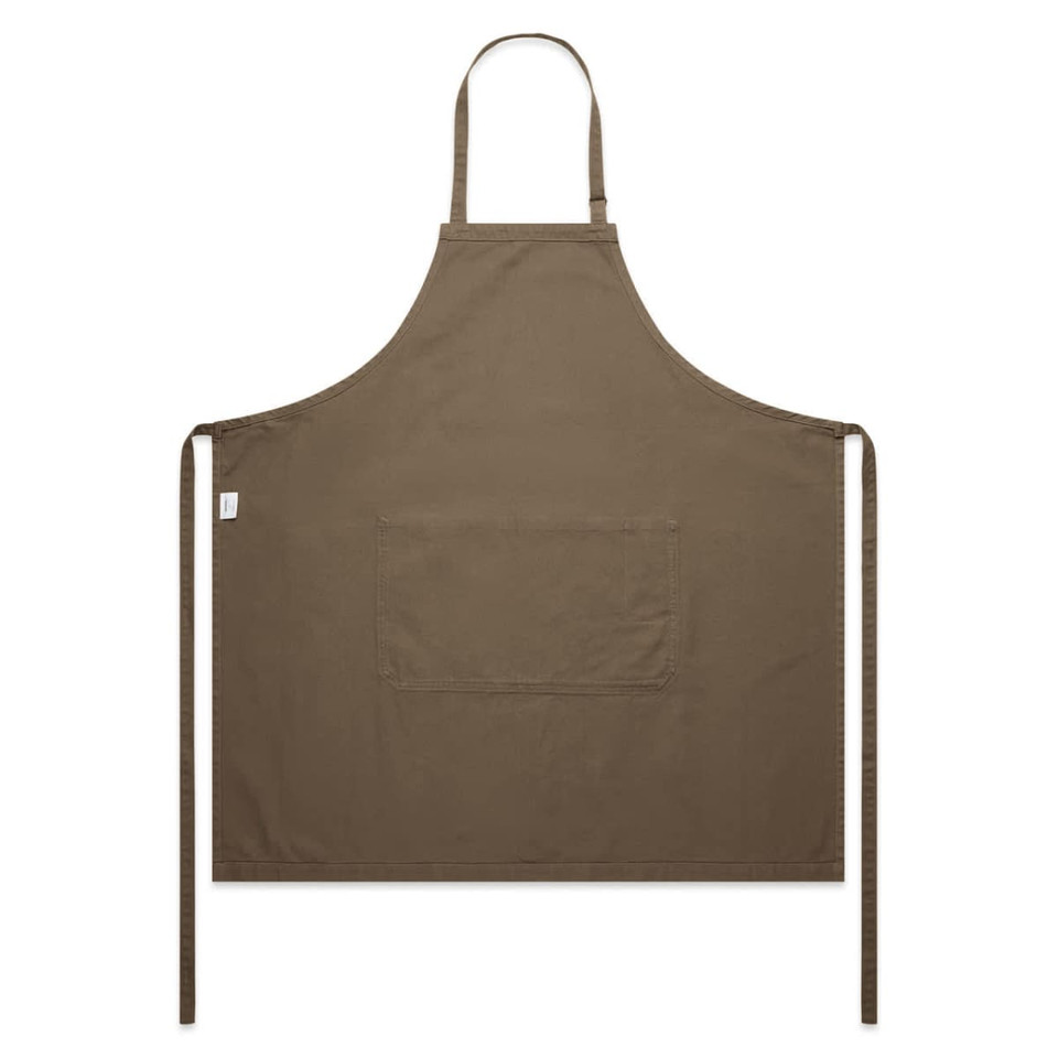 A brown canvas apron featuring a front pocket and neck ties. The apron has a branding label.