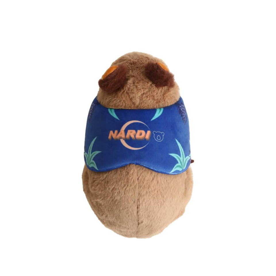 A soft brown wombat plush toy wearing a blue band with a logo. It features detailed facial features and textures.