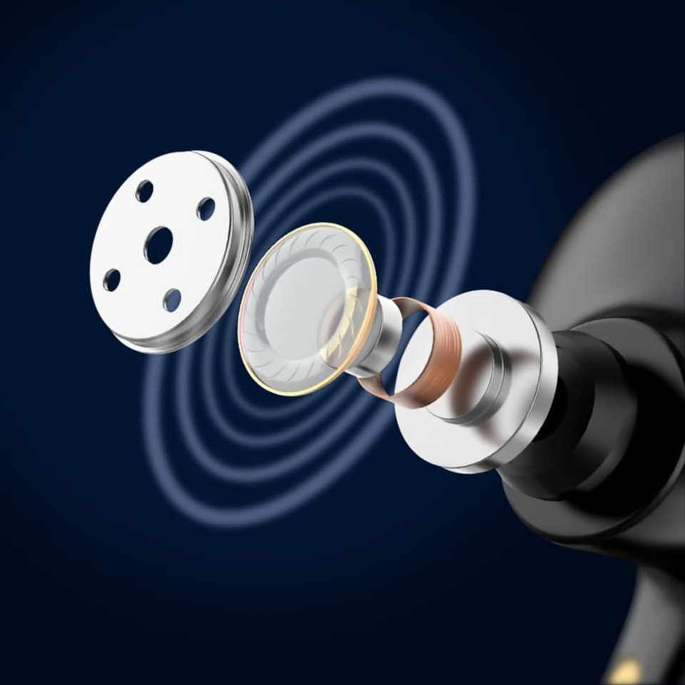 An exploded view of a black earbud component showcasing its internal structure, featuring a silver grill and circular diaphragm.