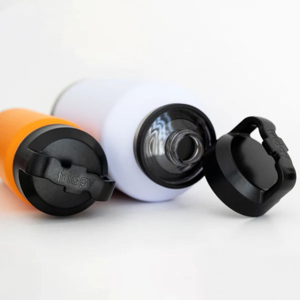 Two Fridgy 1.9L All-Dayer bottles lying on the side. Both have the Fridgy guzzler lid attached to them. One is shut and one is open where the removable part of the lid is leaning against the bottle.