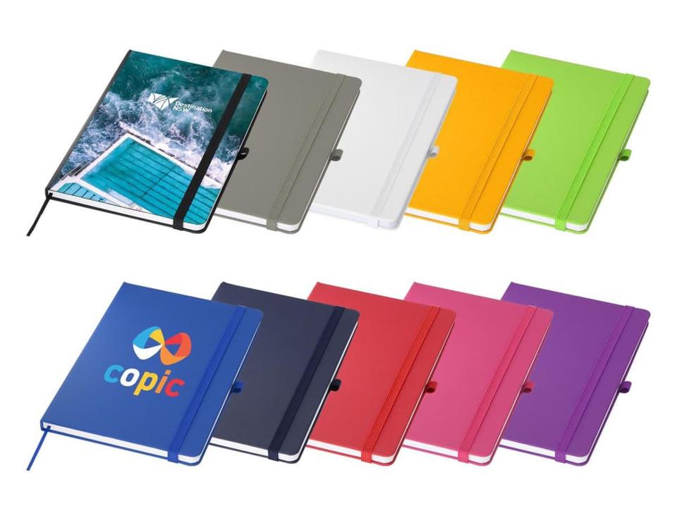 An assortment of A5 notebooks in various colours, featuring a logo on one, with different cover designs and closure bands.