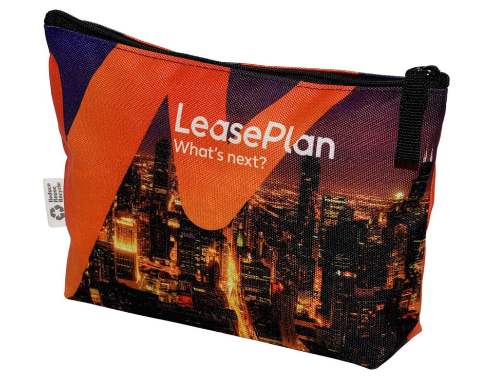 A vibrant orange and black toiletry pouch featuring a city skyline design and a logo. Includes a zip closure.