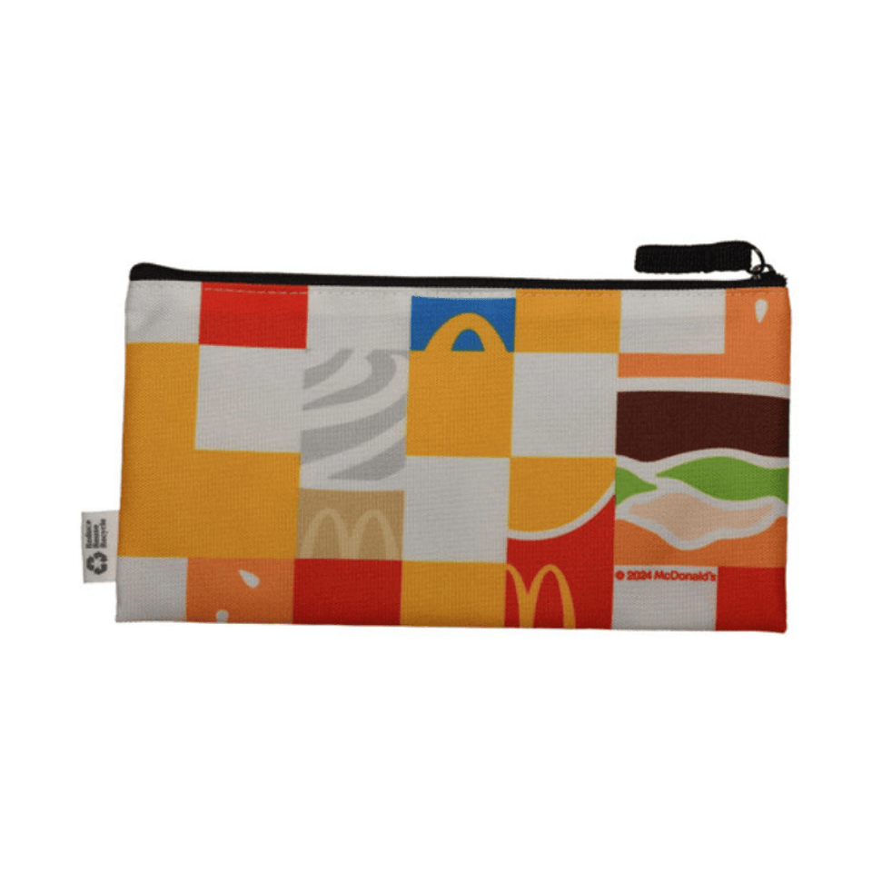 A zippered pouch featuring a colourful design with various food-themed graphics. It includes a logo.