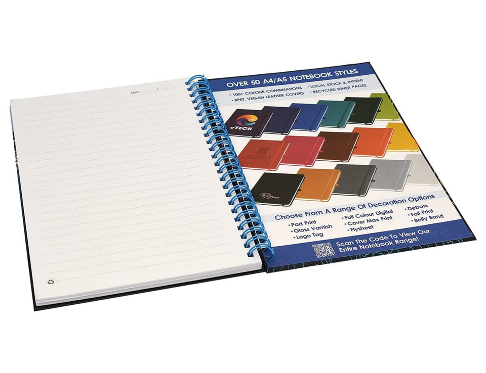 A side-bound A5 notebook with a blue spiral binding, featuring blank pages and a selection of colour options shown alongside.