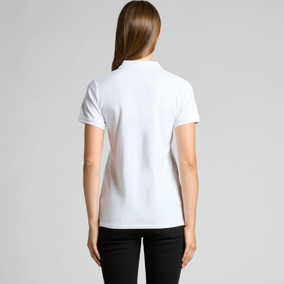 A white pique polo shirt featuring short sleeves and a classic collar, shown from the back.