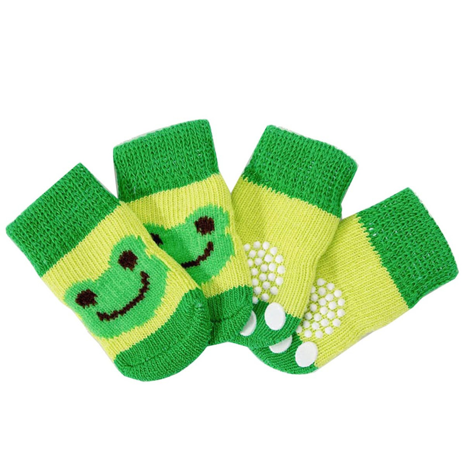 Bright green pet socks featuring a smiling frog design and non-slip bottoms in a striped pattern.