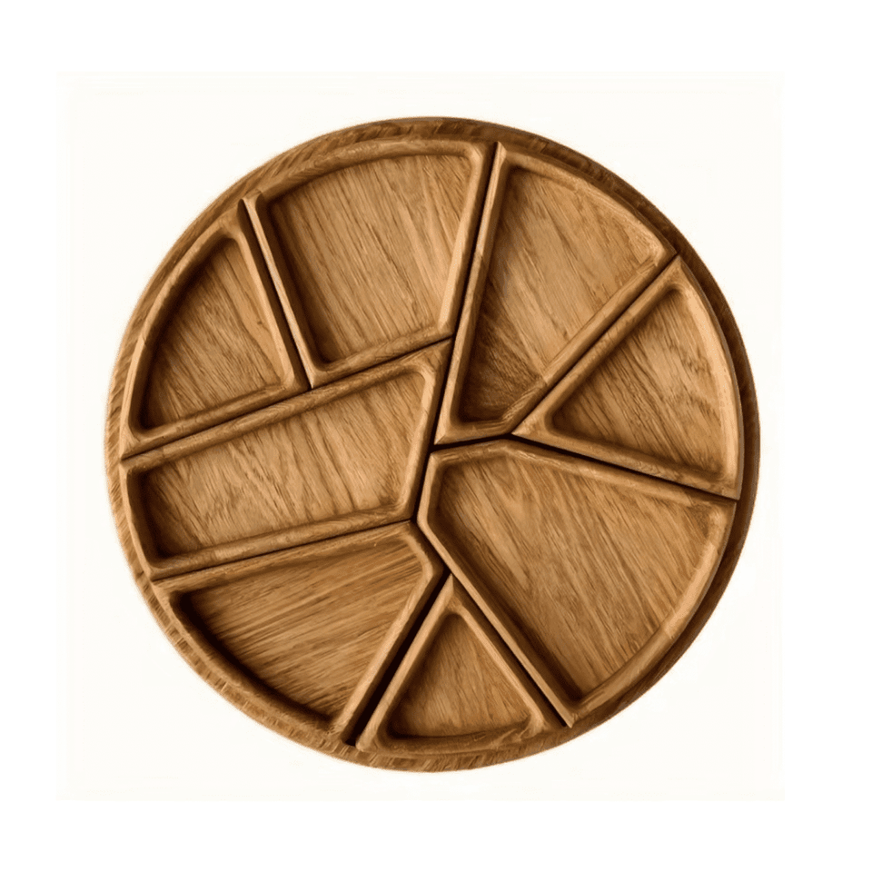A round wooden platter divided into sections, showcasing a natural wood finish and organic shapes.
