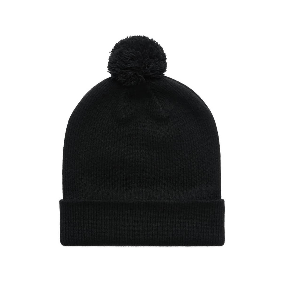 A black beanie with a pom pom on top. It features a ribbed texture and a folded brim.