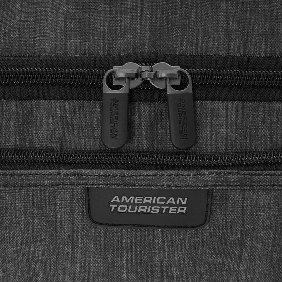 A black and grey duffle bag featuring a zipper closure and a branded logo on the front.