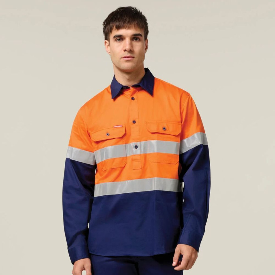 Man wearing an orange and navy taped high-visibility work shirt.