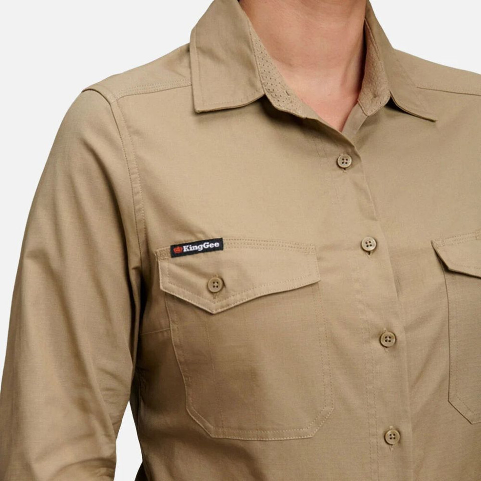 Detail of a khaki long-sleeve utility shirt showing chest and sleeve area with multiple pockets.