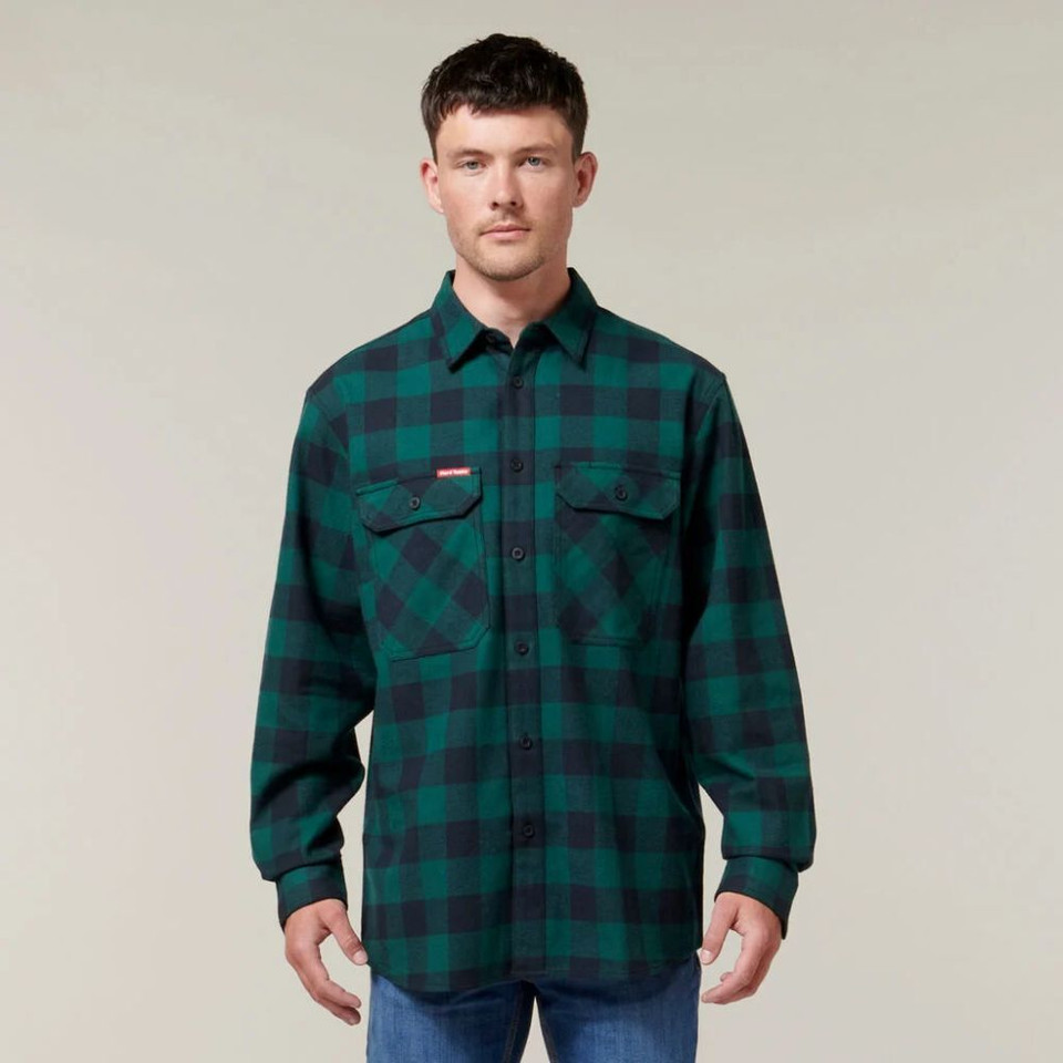 Man wearing green checkered flannel shirt.