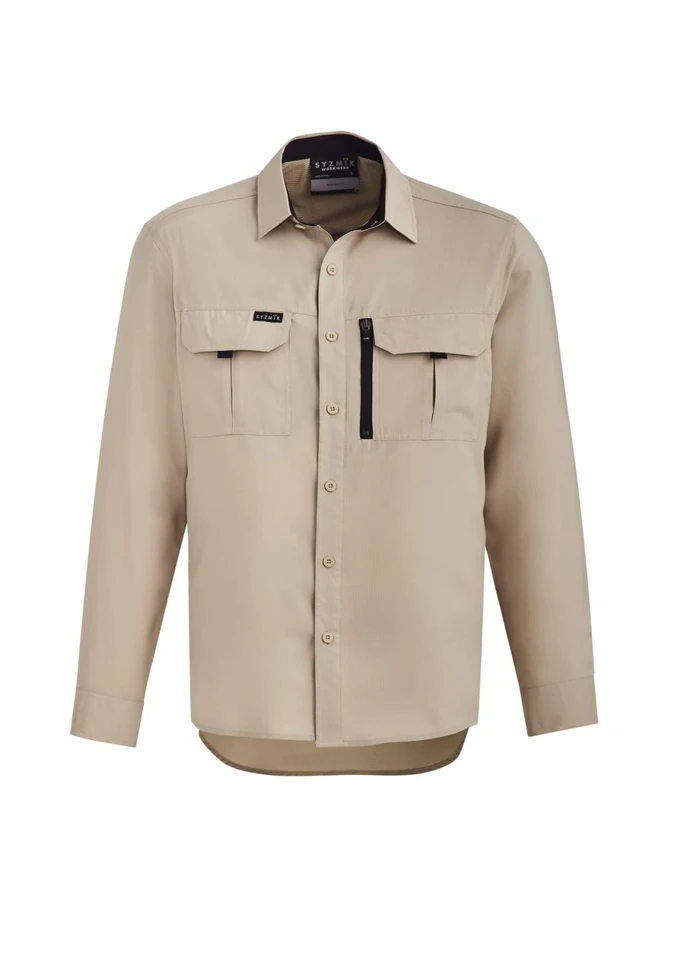 A beige long sleeve button-up shirt with two chest pockets and a zippered pocket, featuring a logo.
