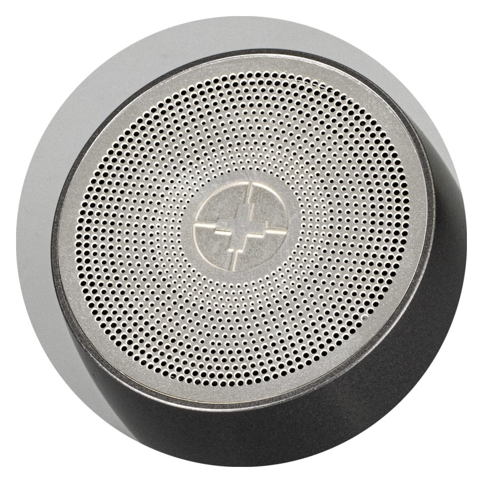 A silver and black portable speaker with a textured surface and a central logo.