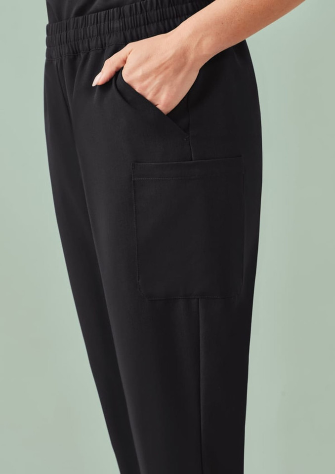 A pair of black women's jogger scrub pants featuring side pockets and an elastic waistband.