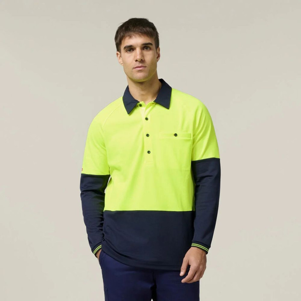 Man wearing a high visibility yellow and navy work polo.