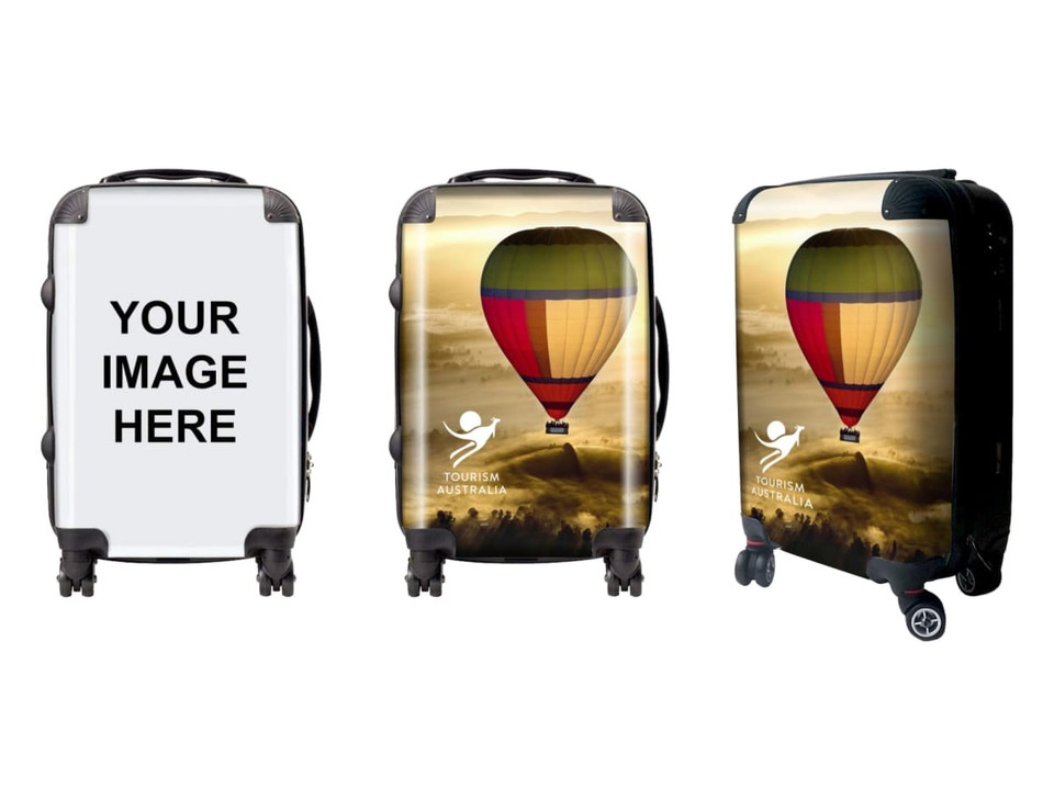 A wheeled suitcase featuring a colourful hot air balloon design, with a black frame and wheels. It has a logo and branding.