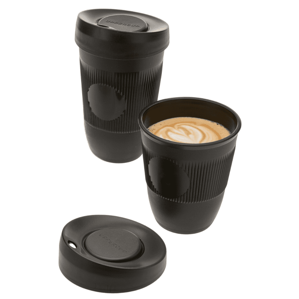 A drink bottle in black, featuring a ribbed design and a matching lid. Includes a cup filled with coffee.