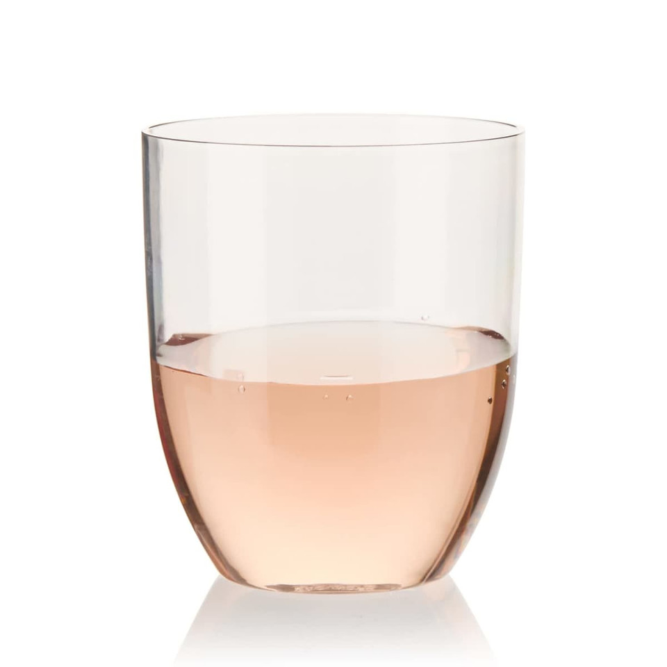 A stemless wine glass in clear recycled Tritan™, filled with pink rosé wine.