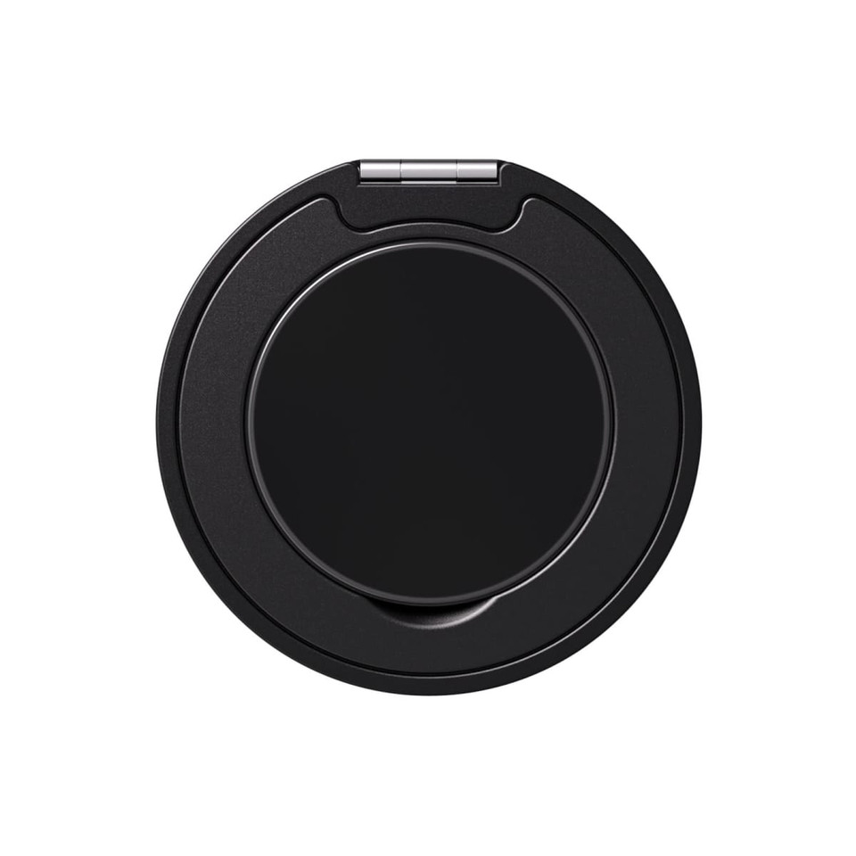 A black phone grip and stand with a circular design and a metal hinge. It features a logo on the surface.