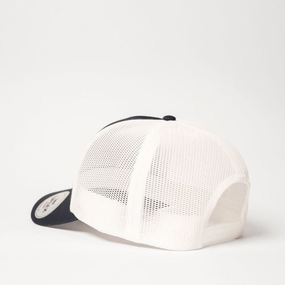 A navy and white UFlex Classic Ultra-lite 5 Panel Trucker Cap featuring a mesh back and a logo.