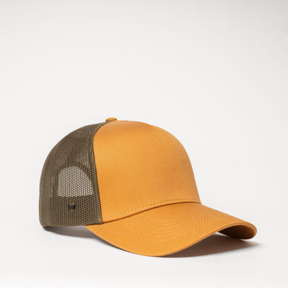 A yellow-orange trucker cap with a mesh back in olive green, featuring a logo on the side.