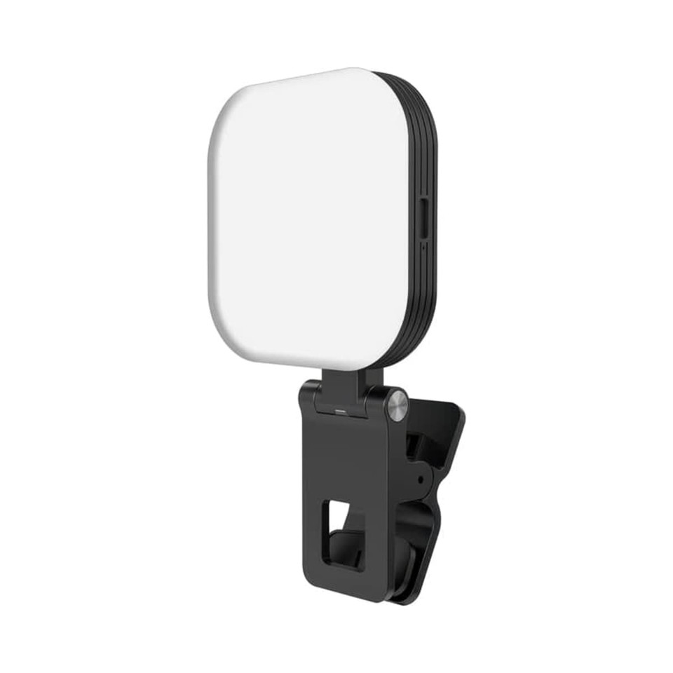 A magnetic LED selfie light in black with a square white panel and adjustable clip for attachment.