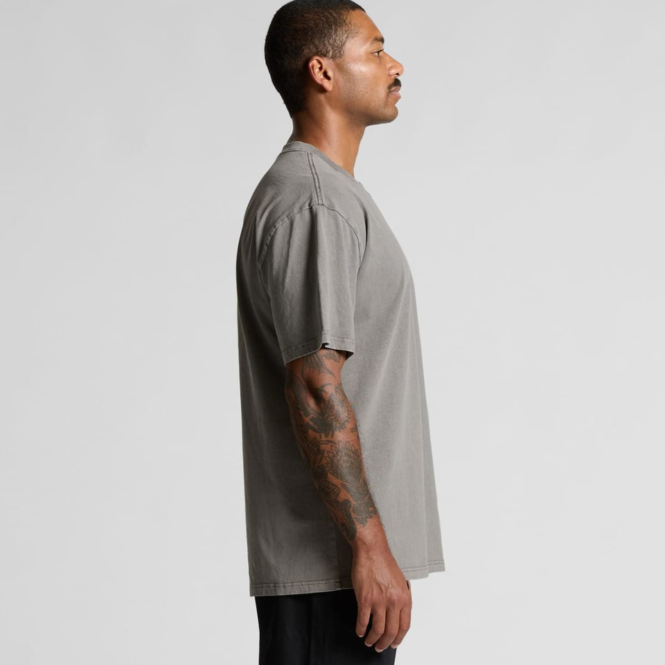 A grey heavy faded tee displayed on a model, showcasing a relaxed fit and short sleeves.