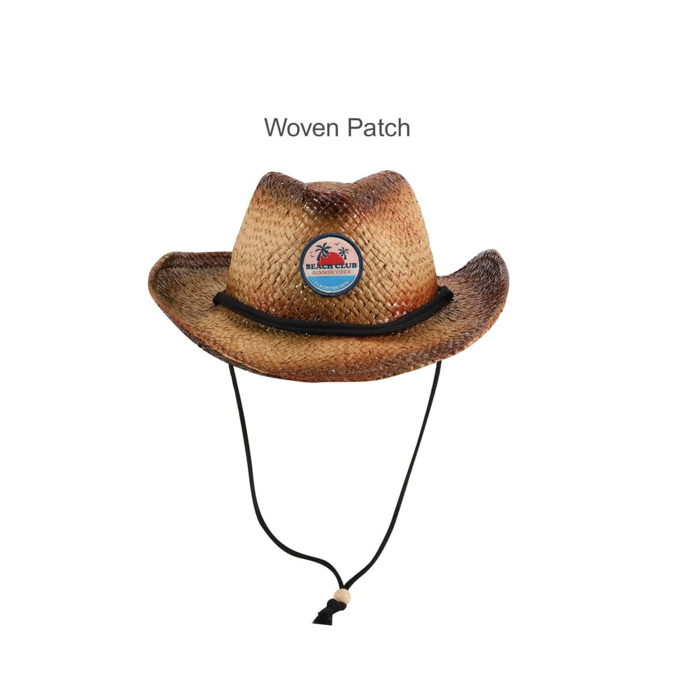 A cowboy straw hat with a woven patch, featuring a neutral brown colour and a decorative black string.