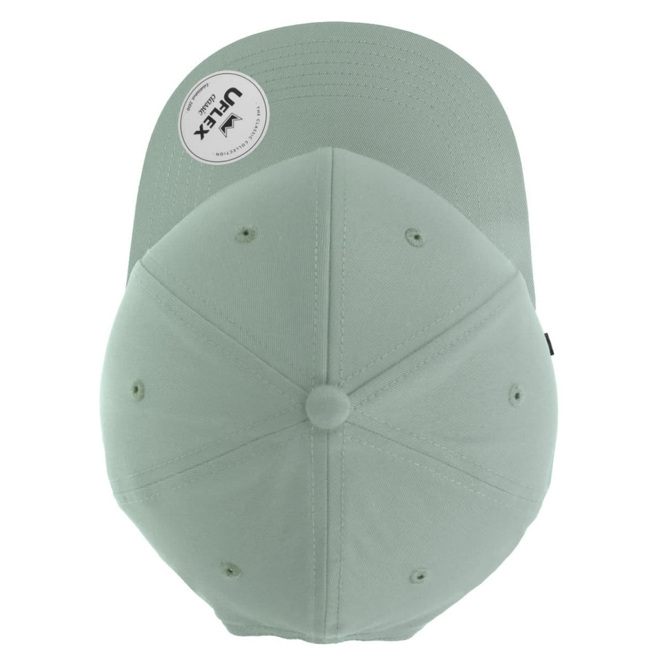 A light green classic six-panel cap with a curved brim and a logo on the side.