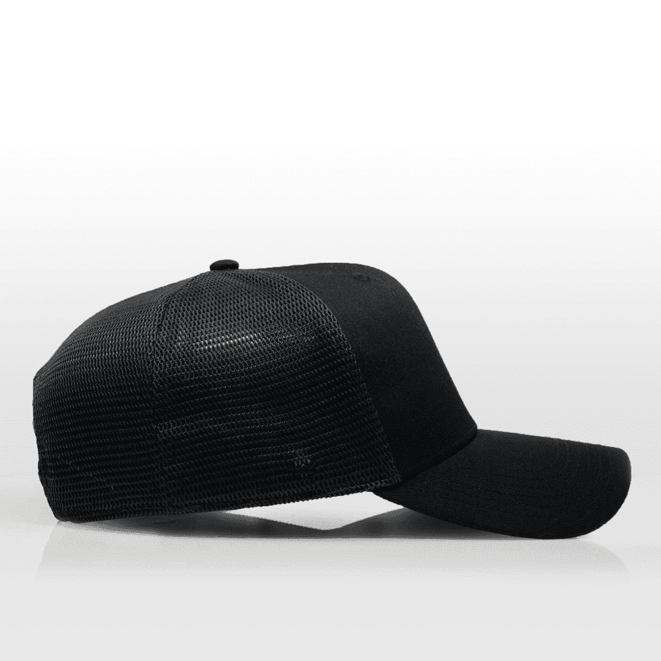 A black 6-panel trucker cap featuring a mesh back and a solid front panel, with an adjustable strap.